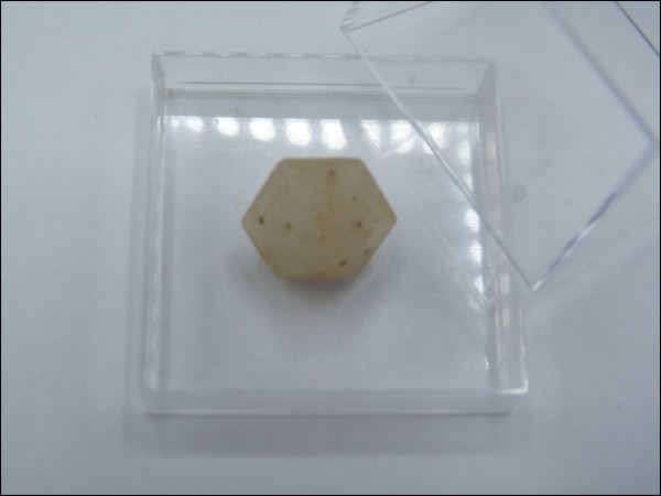 Hexagonal dipyramid quartz crystal middle in box